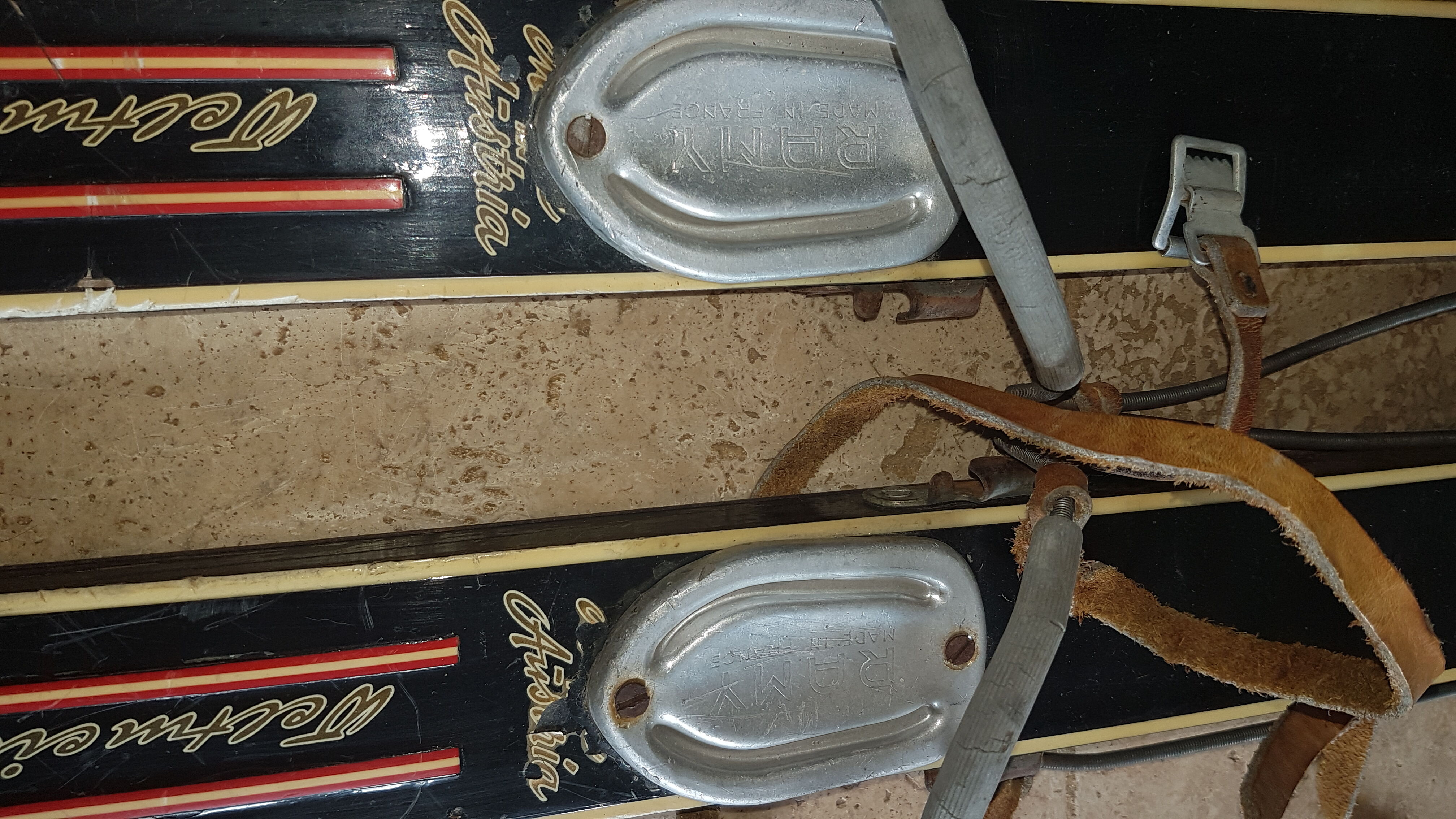 Old skis wooden and its pair of sticks