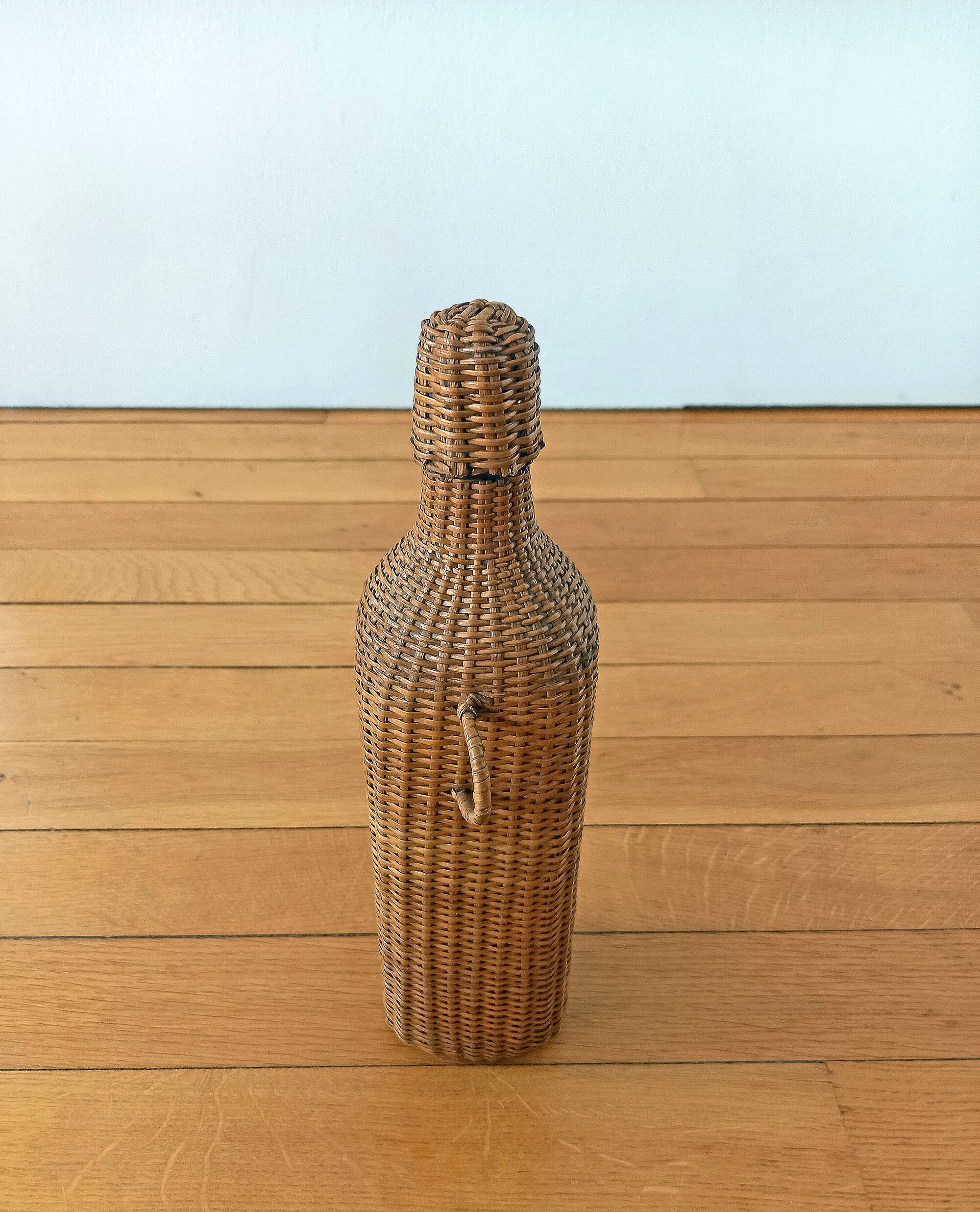 Bottle, old carafe in glass and wicker, 1950s