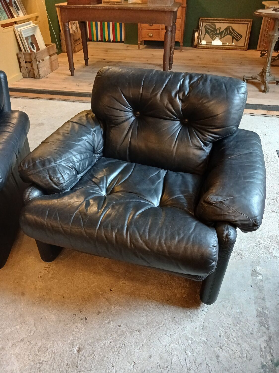 Pair of designer leather armchairs by Tobia Scarpa