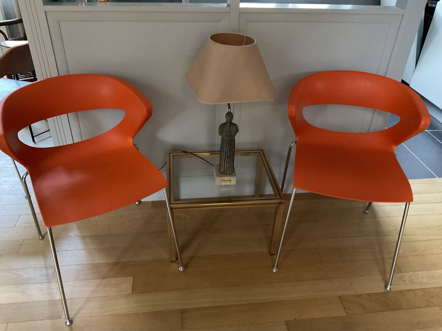 Two orange kicca chairs made in italy tbe