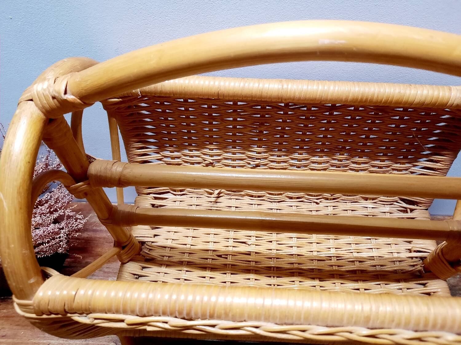 Antique rattan magazine rack