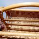 Antique rattan magazine rack
