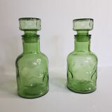 Pair of green moulded glass bottles 70s