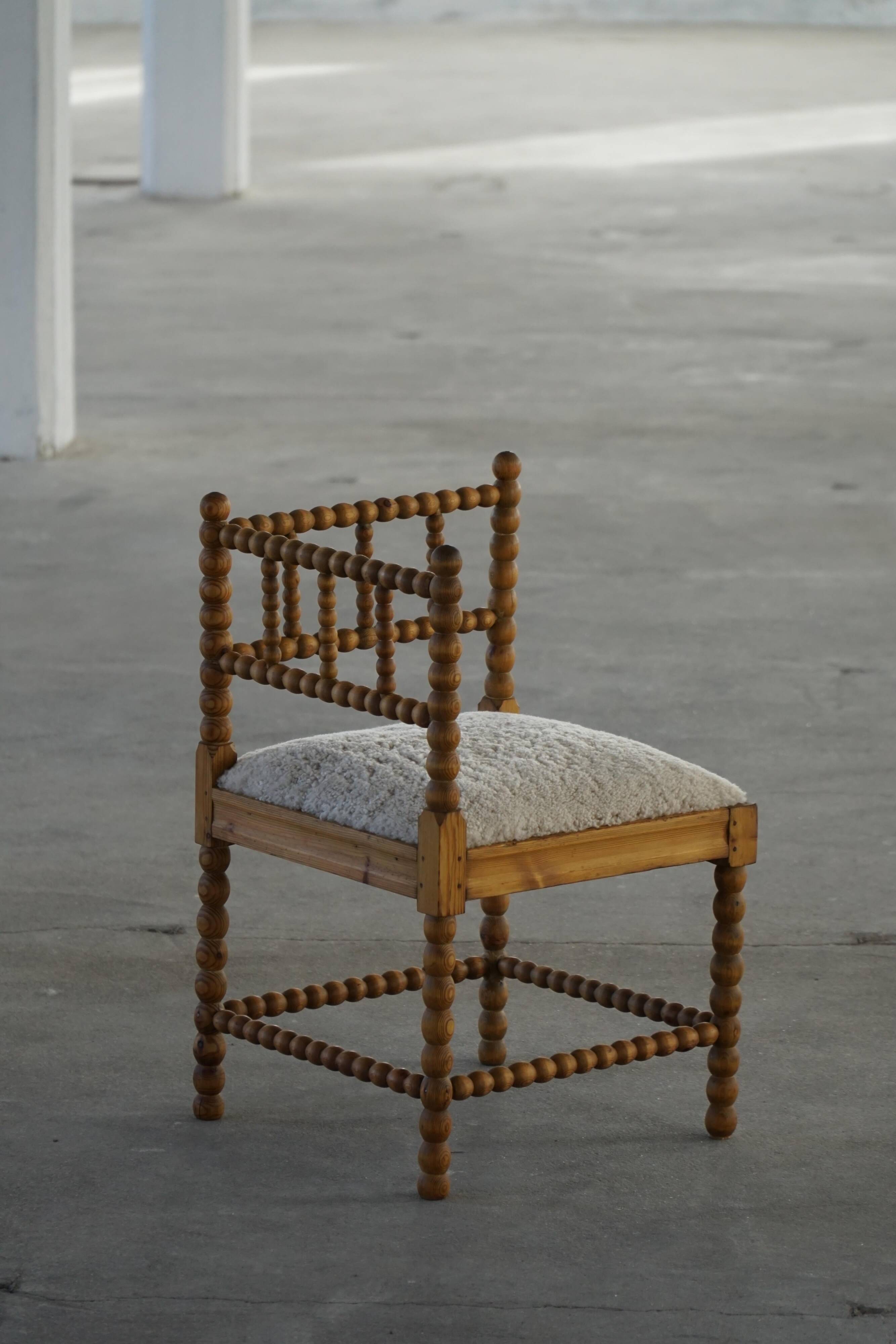 Antique French corner chair handcrafted with lamb's wool, early 20th century.