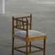 Antique French corner chair handcrafted with lamb's wool, early 20th century.