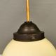 Small Art Deco hanging lamp in cream coloured glass and bakelite top.