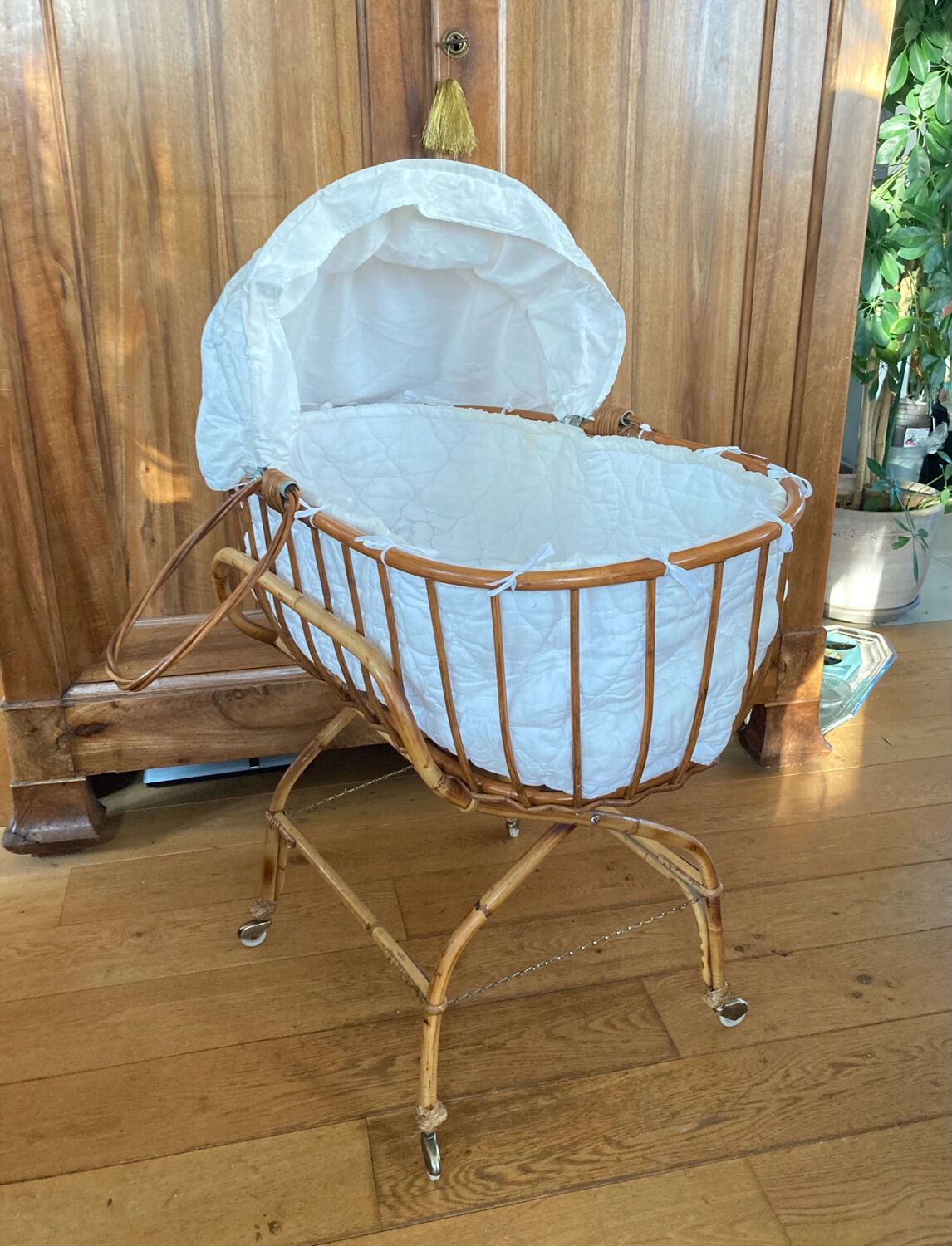 Bamboo, rattan, wicker cradle bassinet from the 1960s with a foldable support.