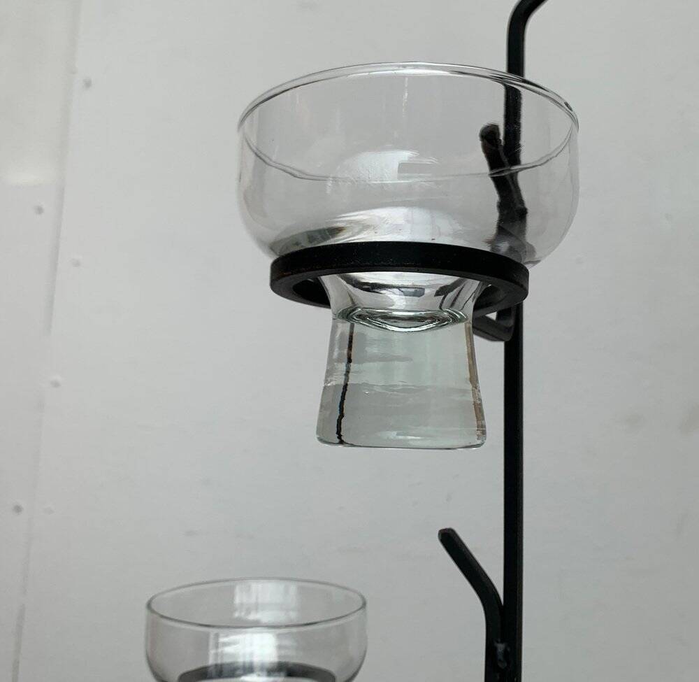 Mid-century metal and glass pendant light from the 1960s.