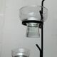 Mid-century metal and glass pendant light from the 1960s.