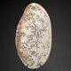Perforated shell hand-decorated on a wooden base