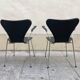 Pair of Arne Jacobsen series 7 chairs in black leather