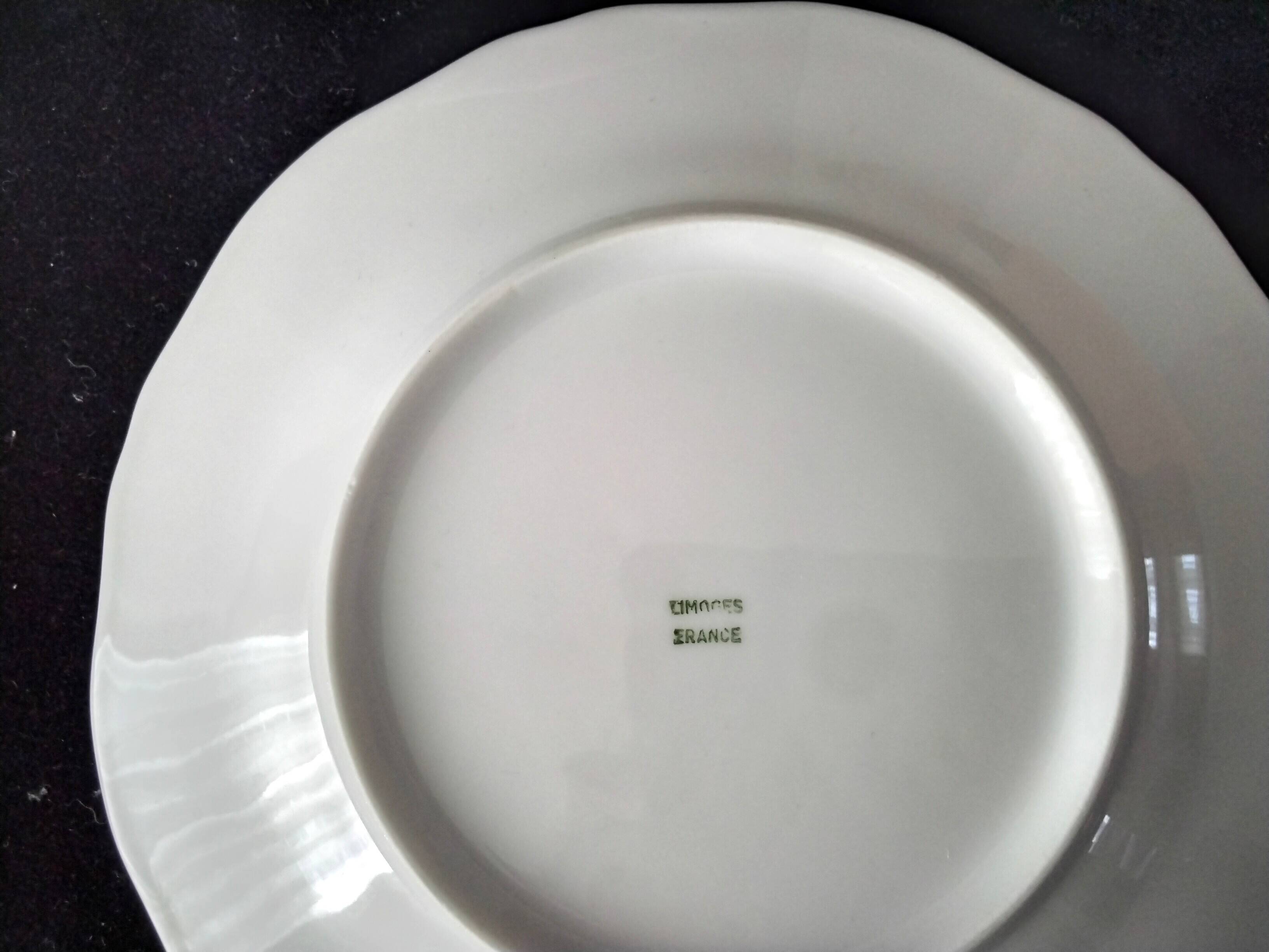 4 white Limoges porcelain dessert plates