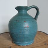 Sandstone pitcher painted in turquoise, very old pottery