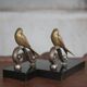 Vintage bookends, brass bird on black marble base, brass animals