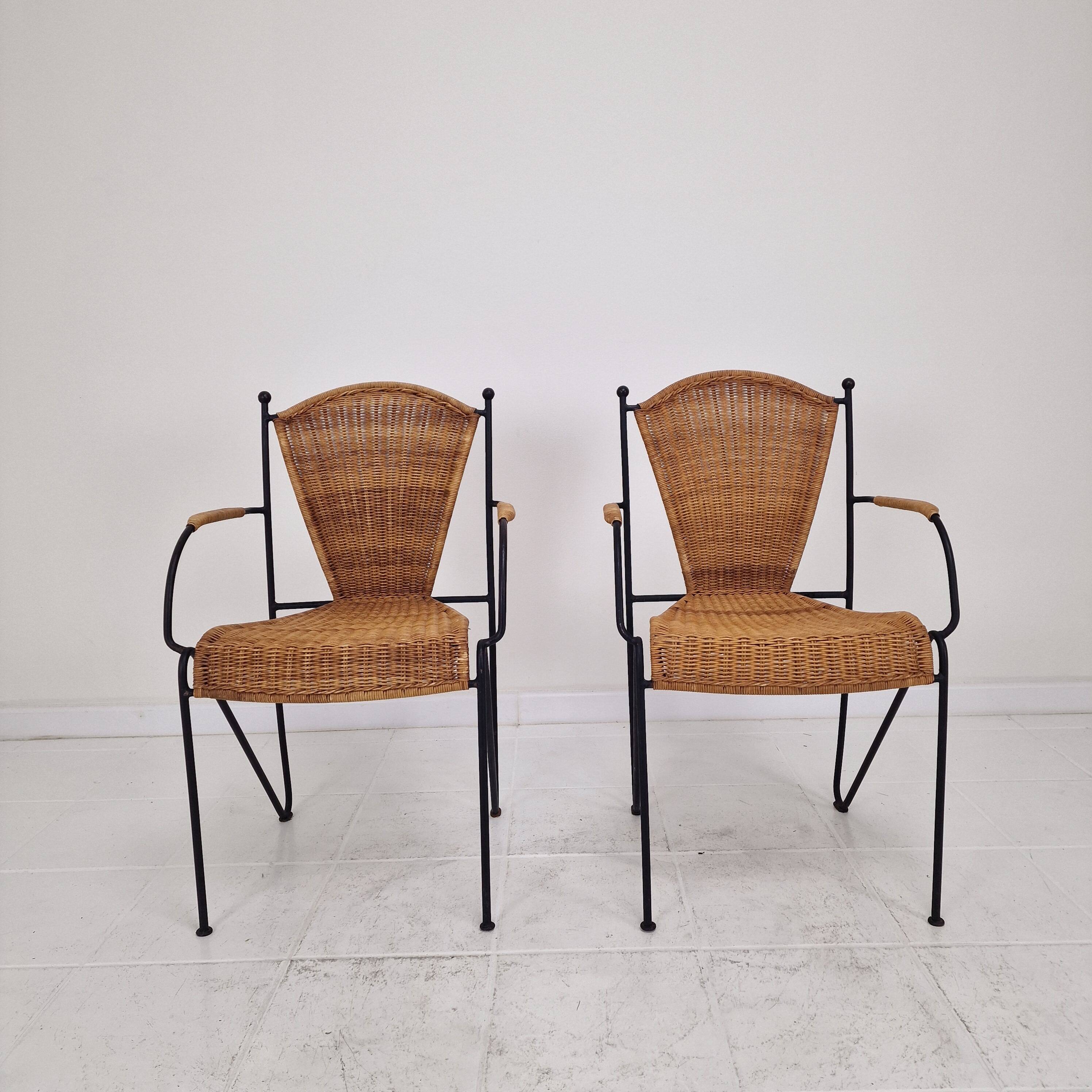Pair of wicker and iron armchairs by Frederic Weinberg, United States, 1950s.