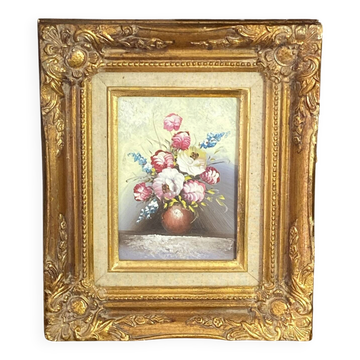 Still life, painting on hardboard, wooden and stucco frame.