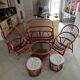 Sofa armchairs and coffee table in vintage rattan of six pieces