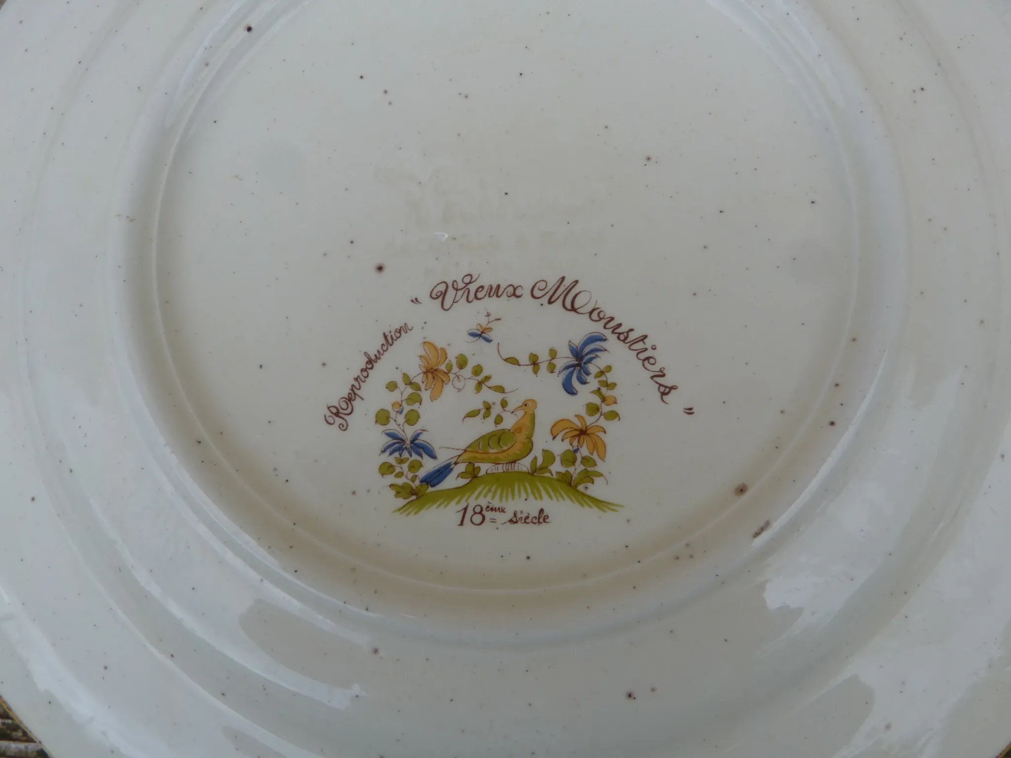 Plate reproduction of old Moustier from the 18th century.