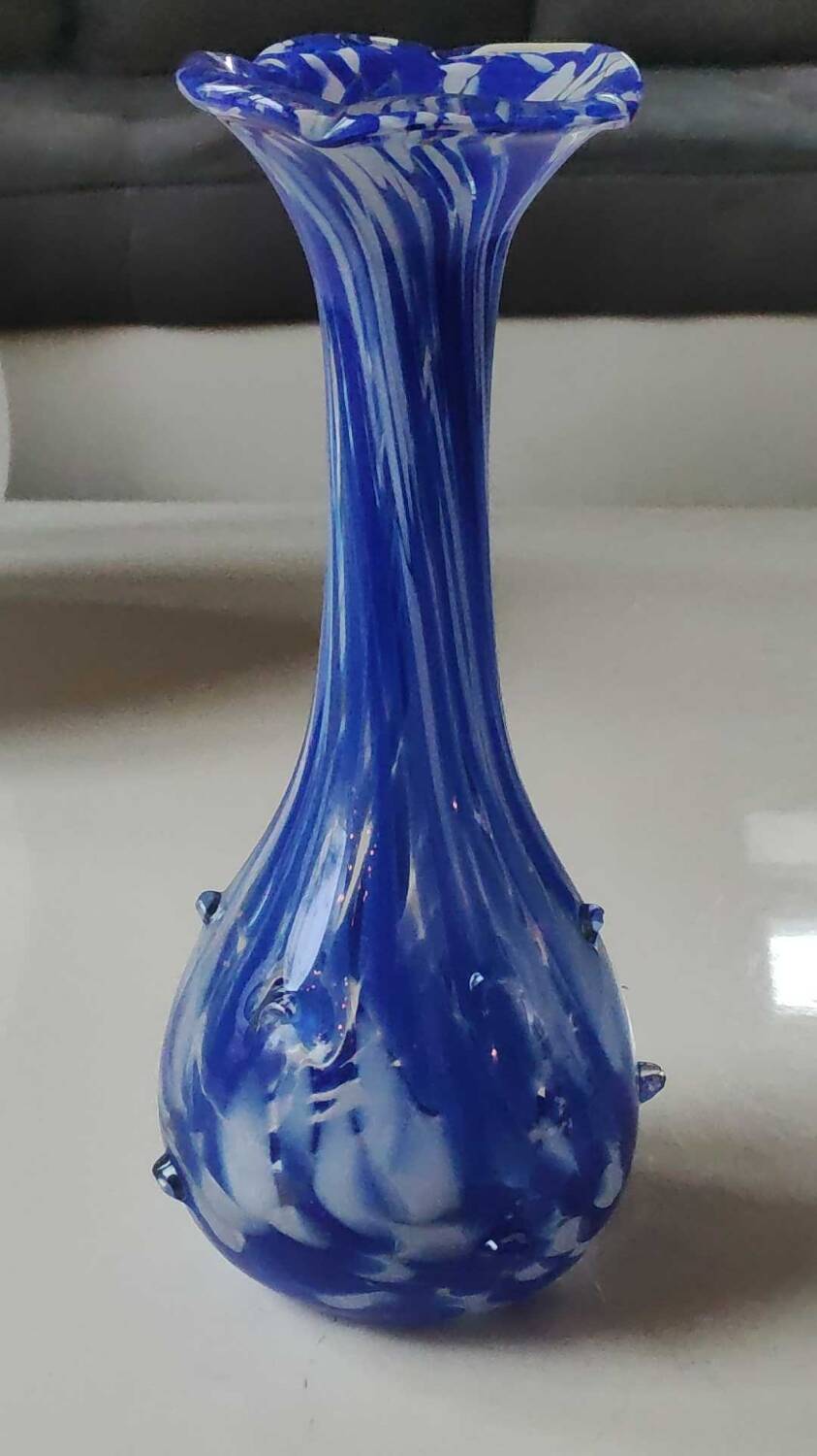 Murano style floral vase. Corolla neck, speckled cobalt blue & white. Dim 24 x 10 cm