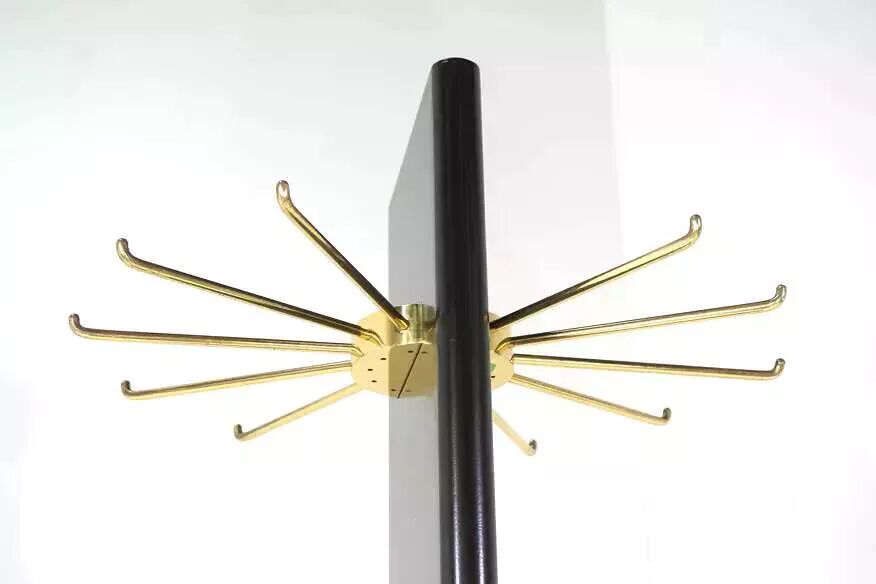 Swivel coat rack in black lacquered wood and brass
