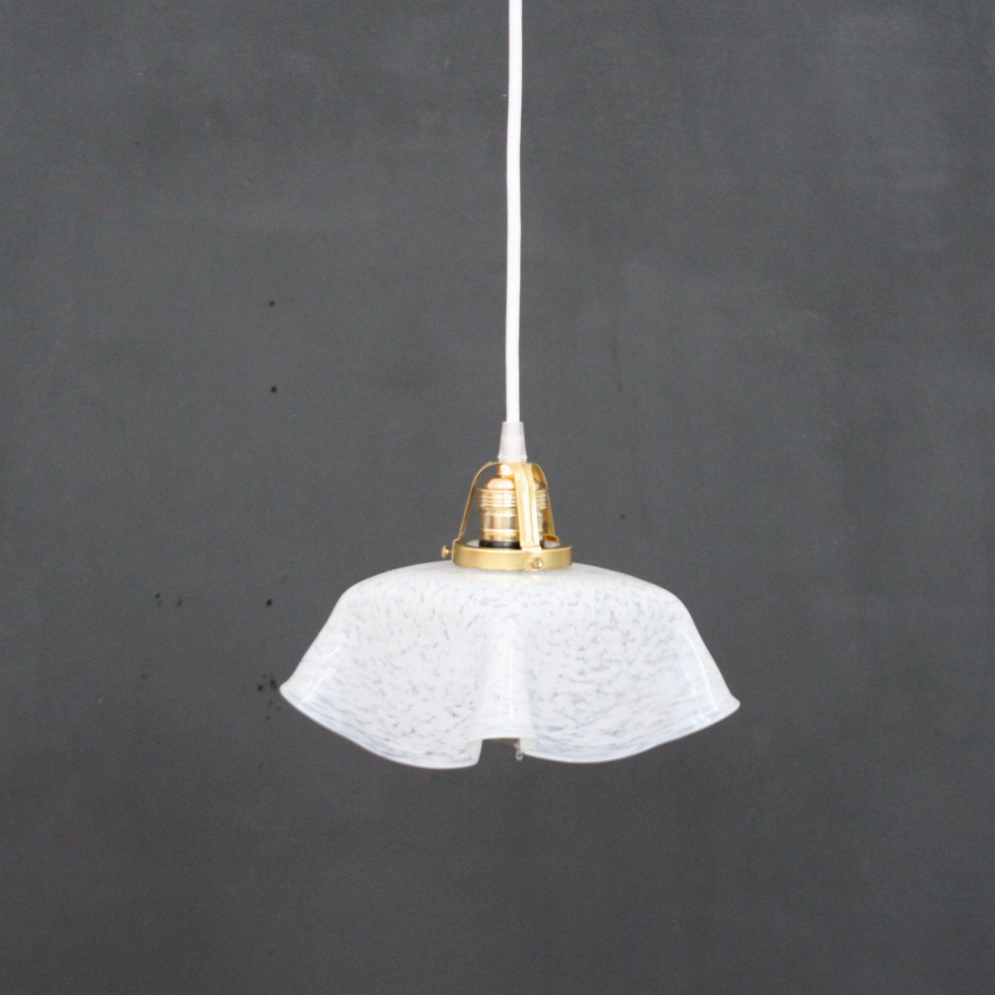 Hanging lamp draped in glass