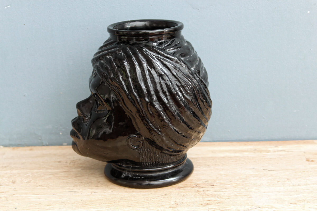 Molded glass vase, nubian's head