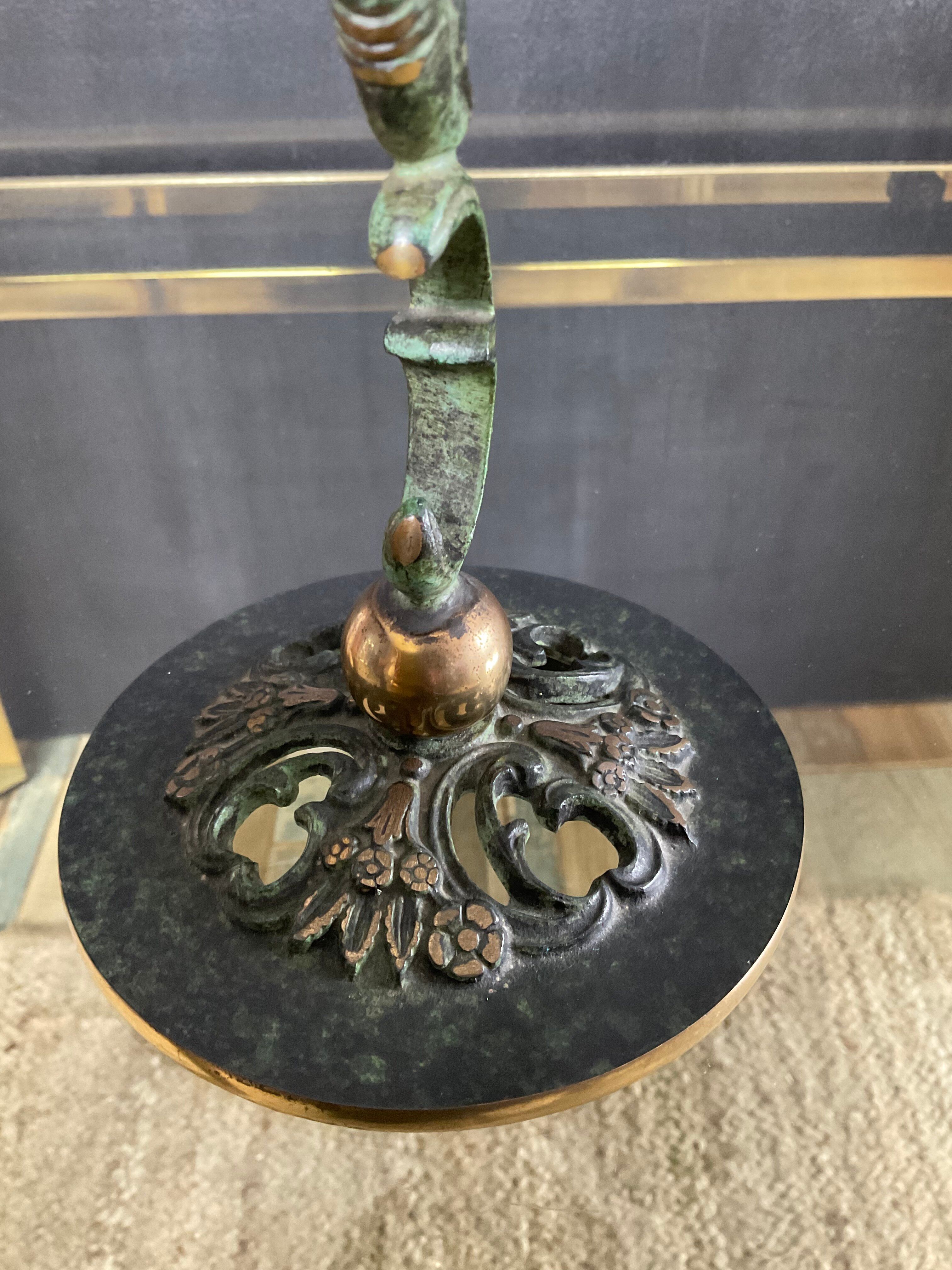 Empire style bronze candlestick with a candle holder