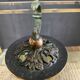 Empire style bronze candlestick with a candle holder