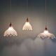 Trio of Art Deco scalloped clear glass pendant lights, 1920-30