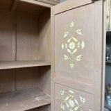Large antique wardrobe painted with floral decoration.