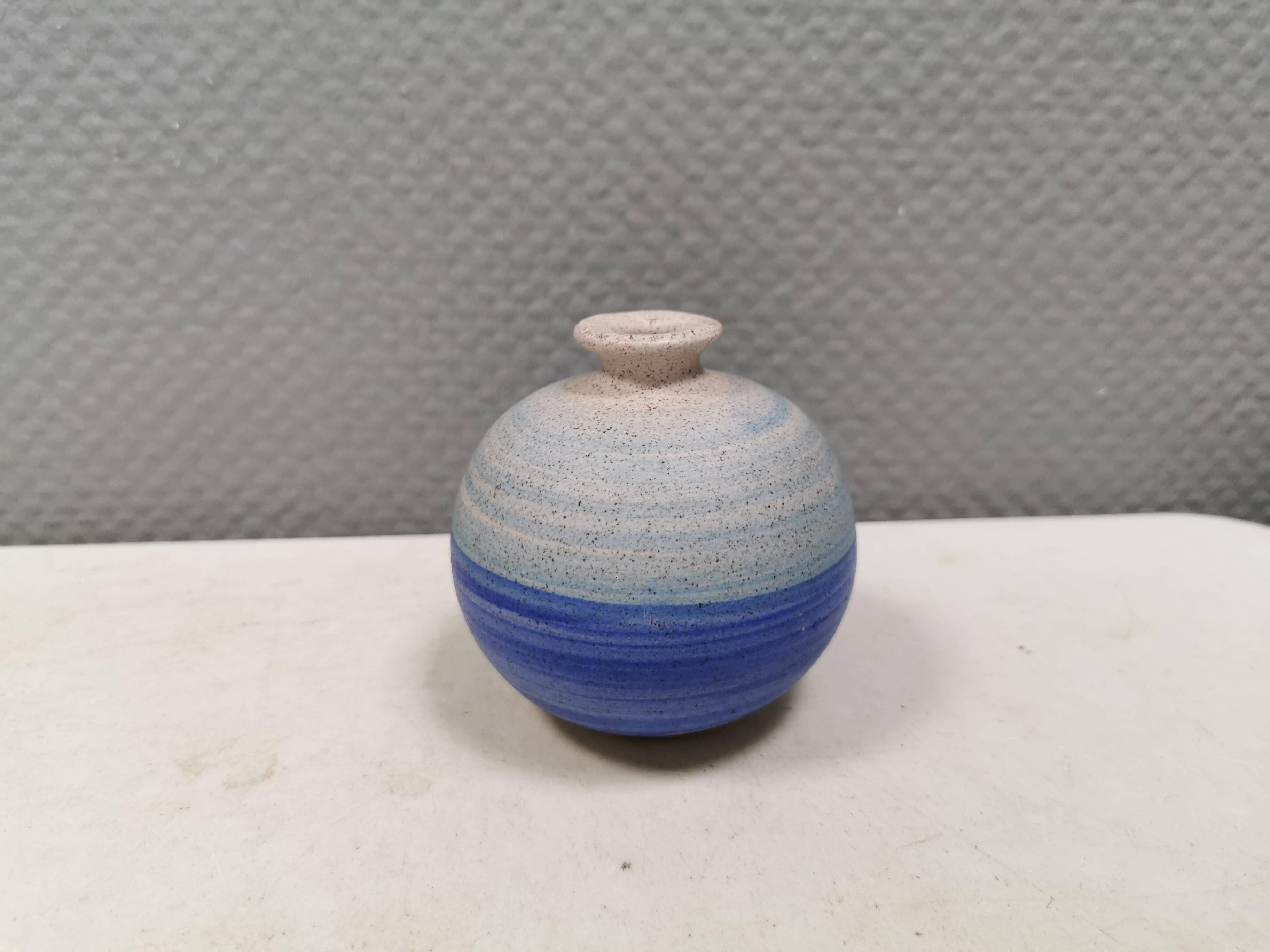 A small, round, beautiful ceramic vase from Denmark, dating from the 1980s.