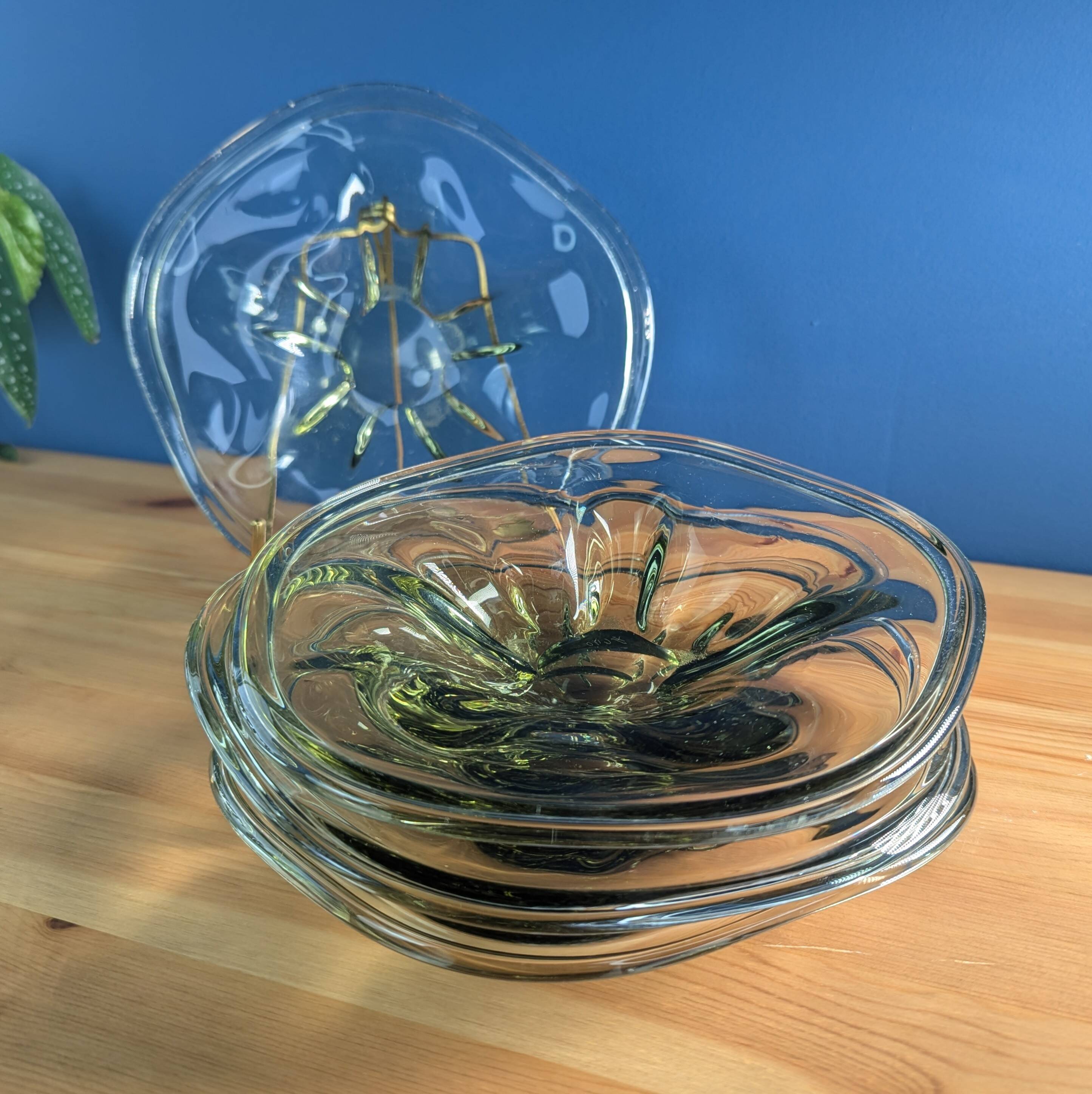 4 wavy glass bowls plates in smoked green design, signed and numbered