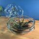 4 wavy glass bowls plates in smoked green design, signed and numbered