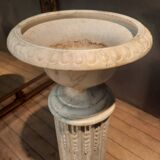 Column topped with a plaster basin.