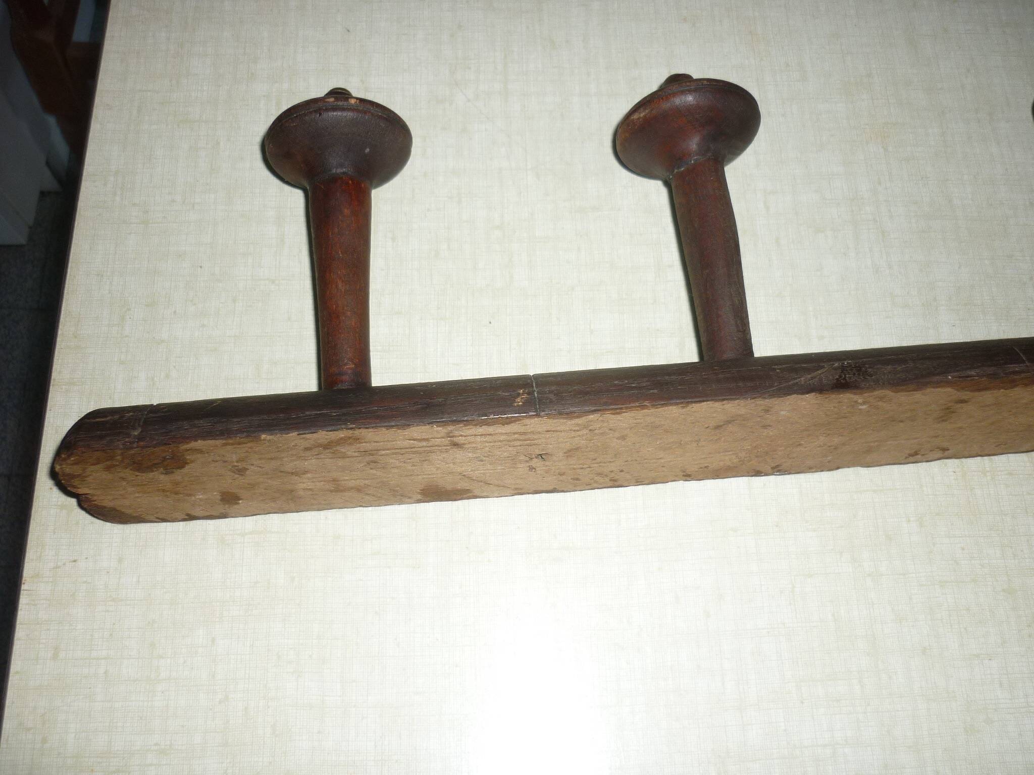 Wooden wall-mounted coat rack