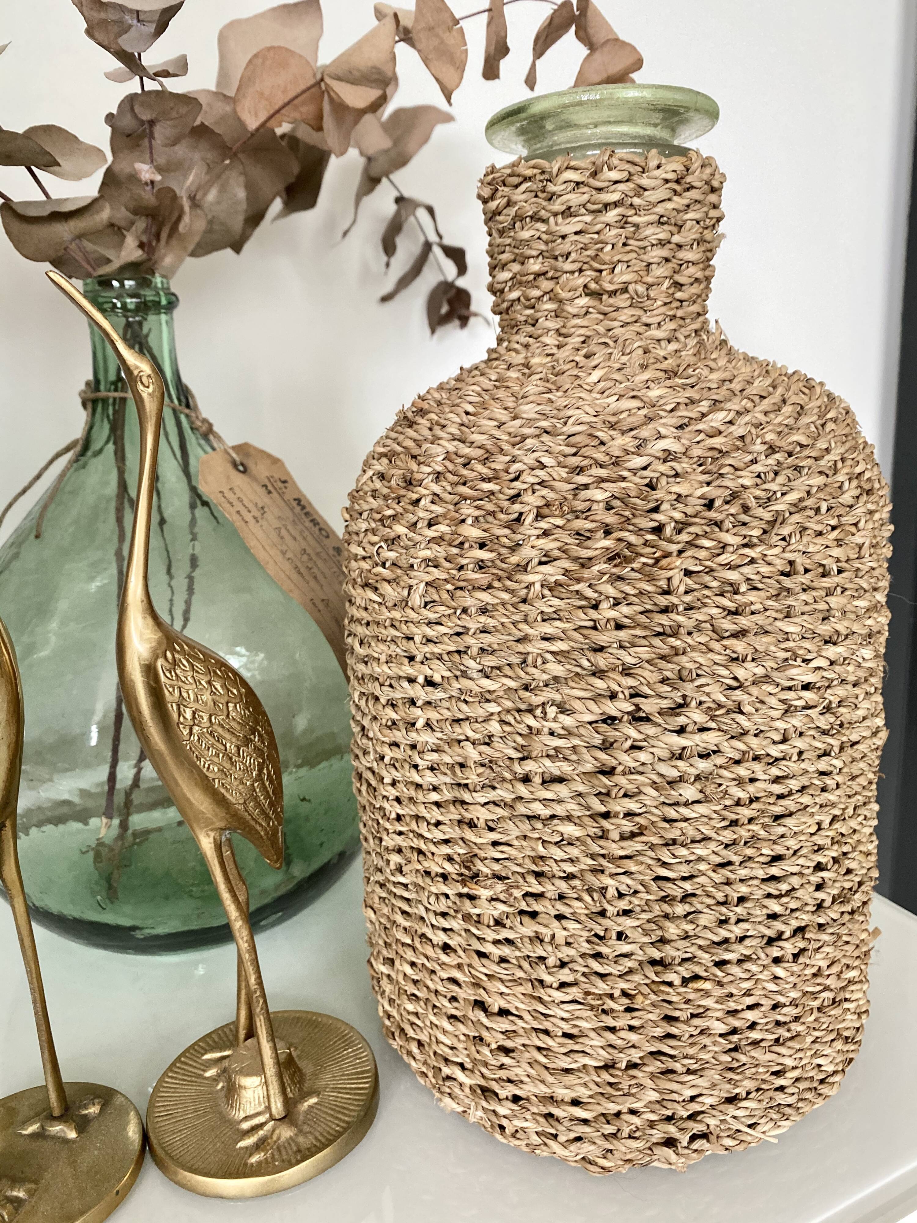 Glass bottle and braided rope