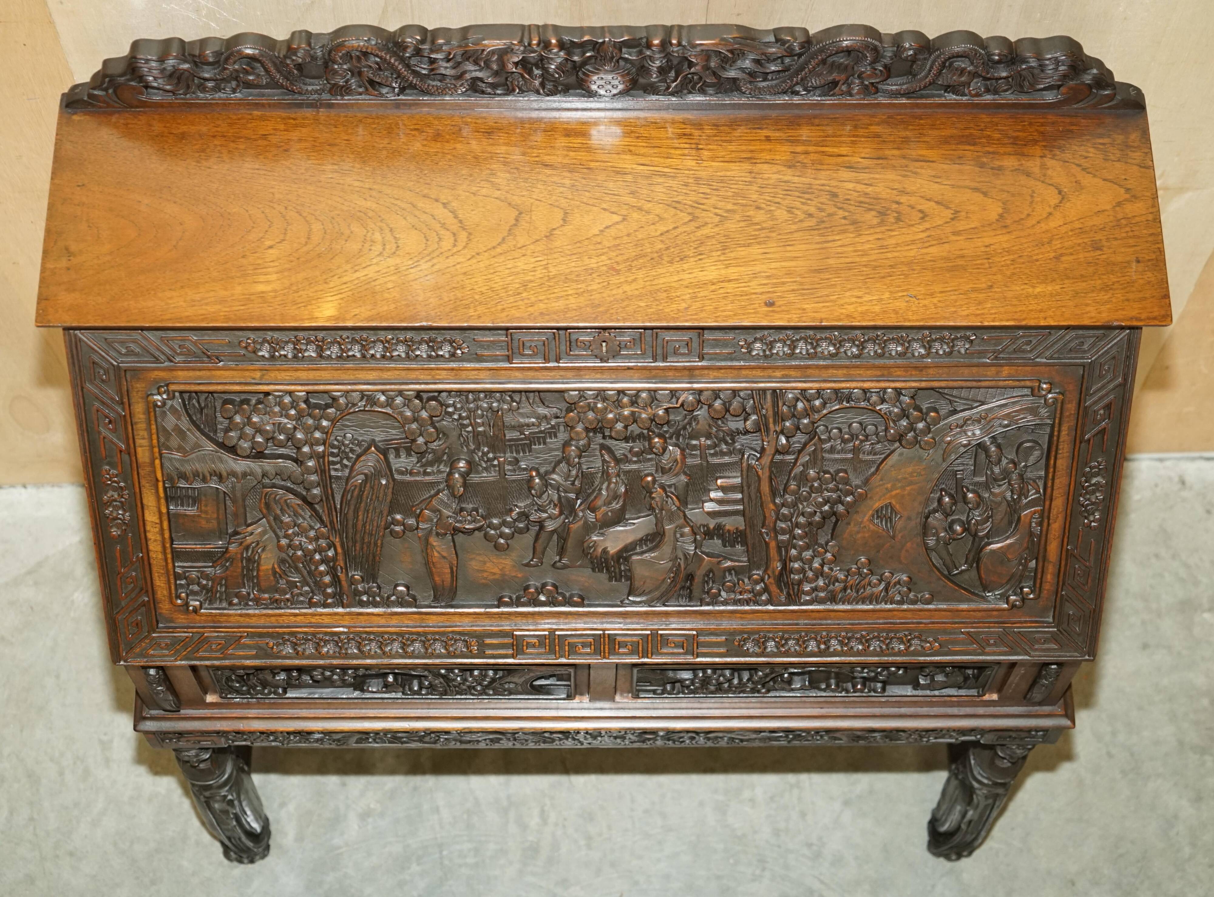 Chinese hand-carved desk from around 1940 with matching chair.