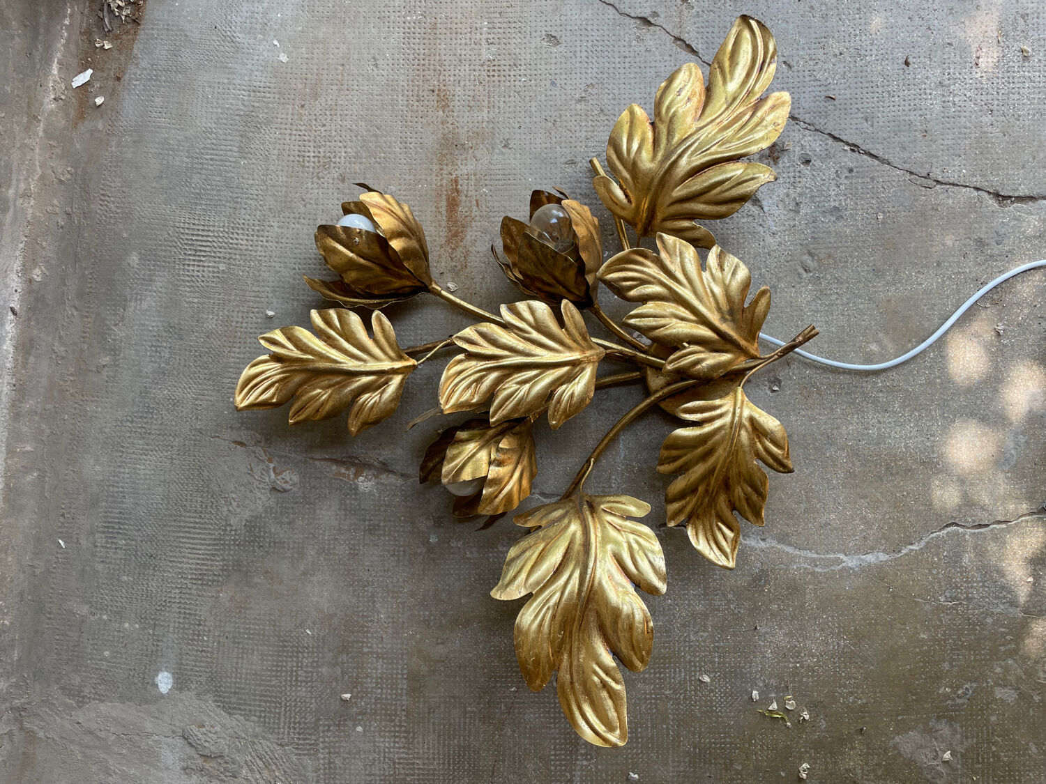 Golden wall lamp foliage