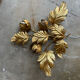 Golden wall lamp foliage