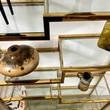 Old shelf in golden metal brass geometric library design 80s vintage