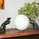 Lampe art déco marbre globe opaline et lévriers en régule, 1930