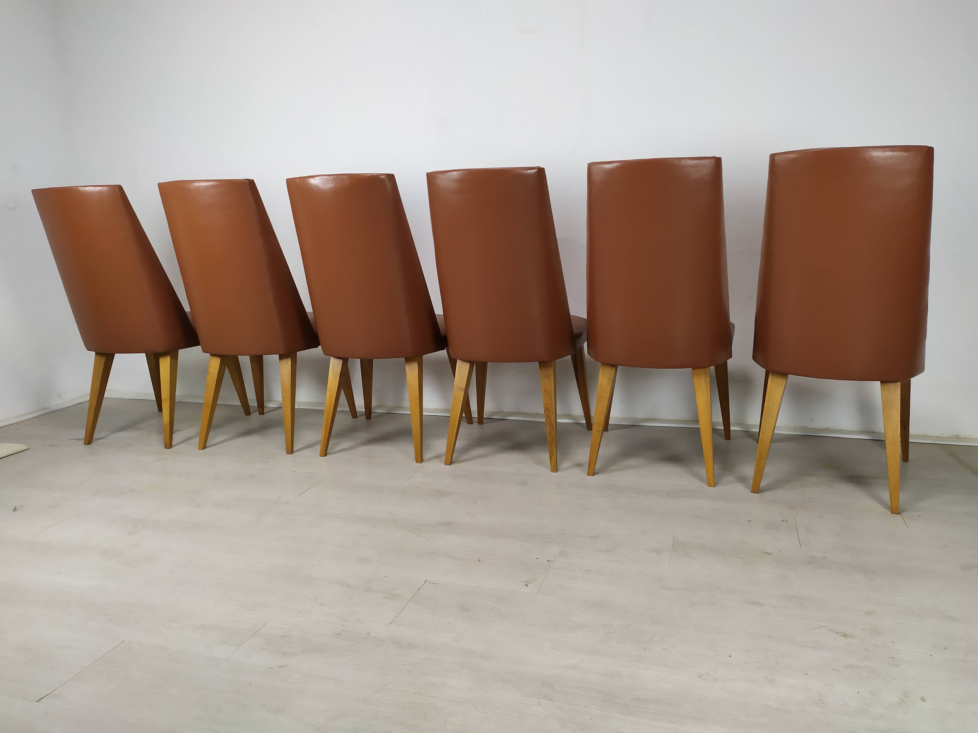 8 brown skai chairs 1950