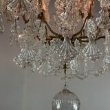 Bronze cage chandelier adorned with molded glass pendants in the shape of peacock feathers, circa 1800