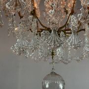 Bronze cage chandelier adorned with molded glass pendants in the shape of peacock feathers, circa 1800
