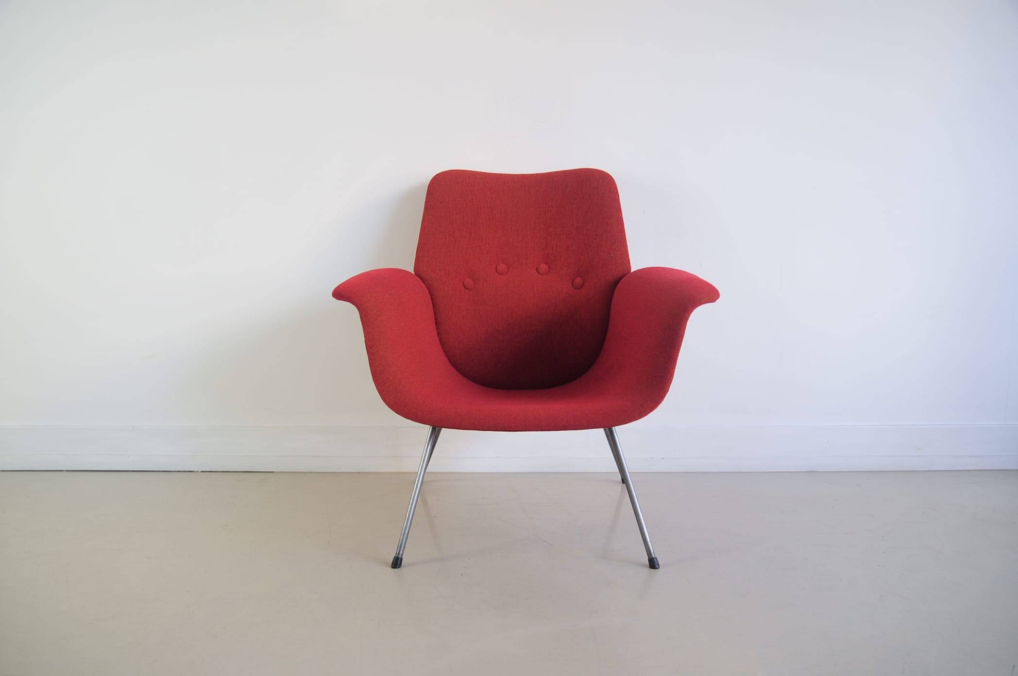 Red armchair with metal legs