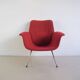 Red armchair with metal legs