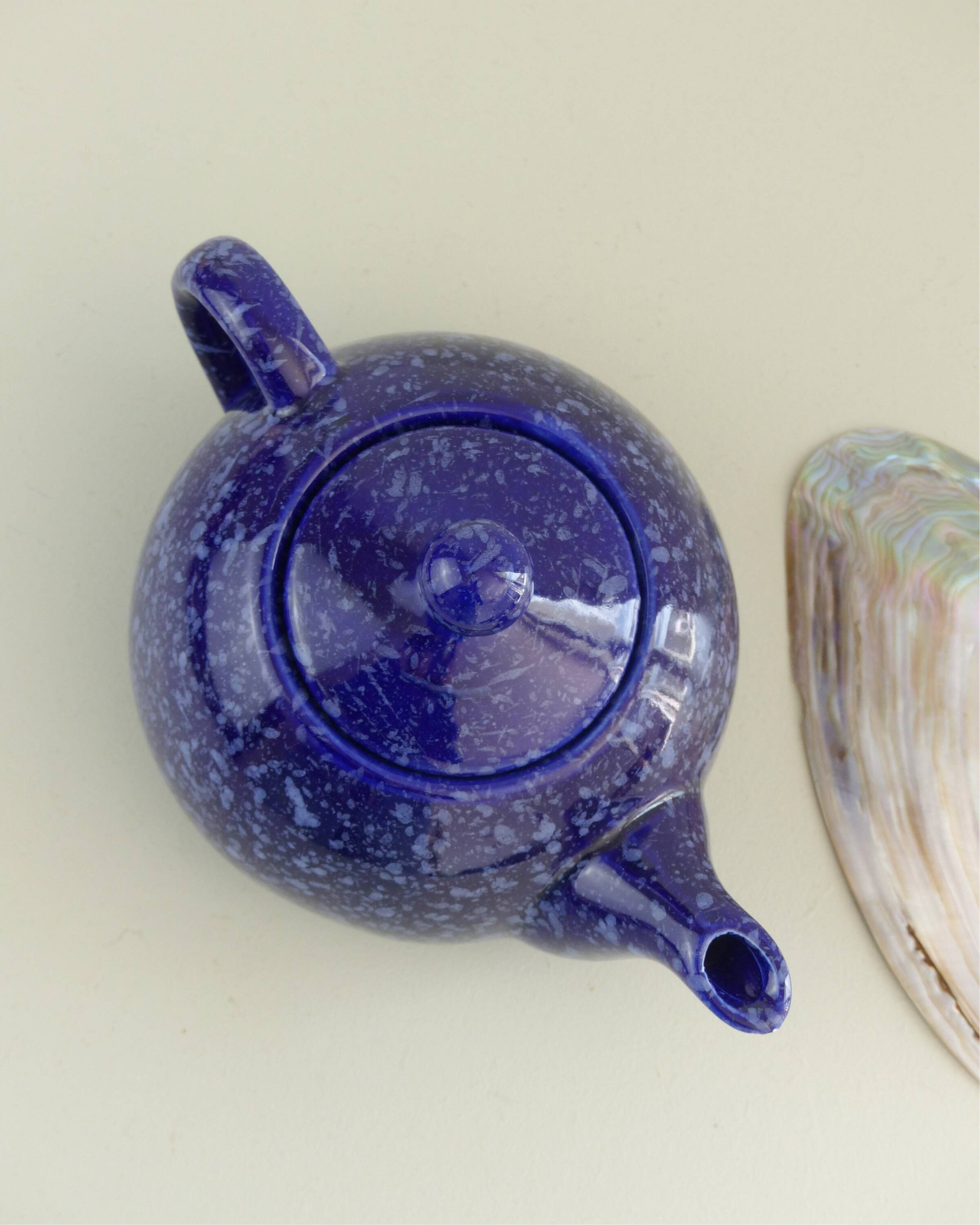 Blue glazed and speckled ceramic teapot