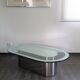 Vintage coffee table with glass and chrome metal.