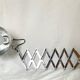 Vintage accordion wall light in chrome metal.
