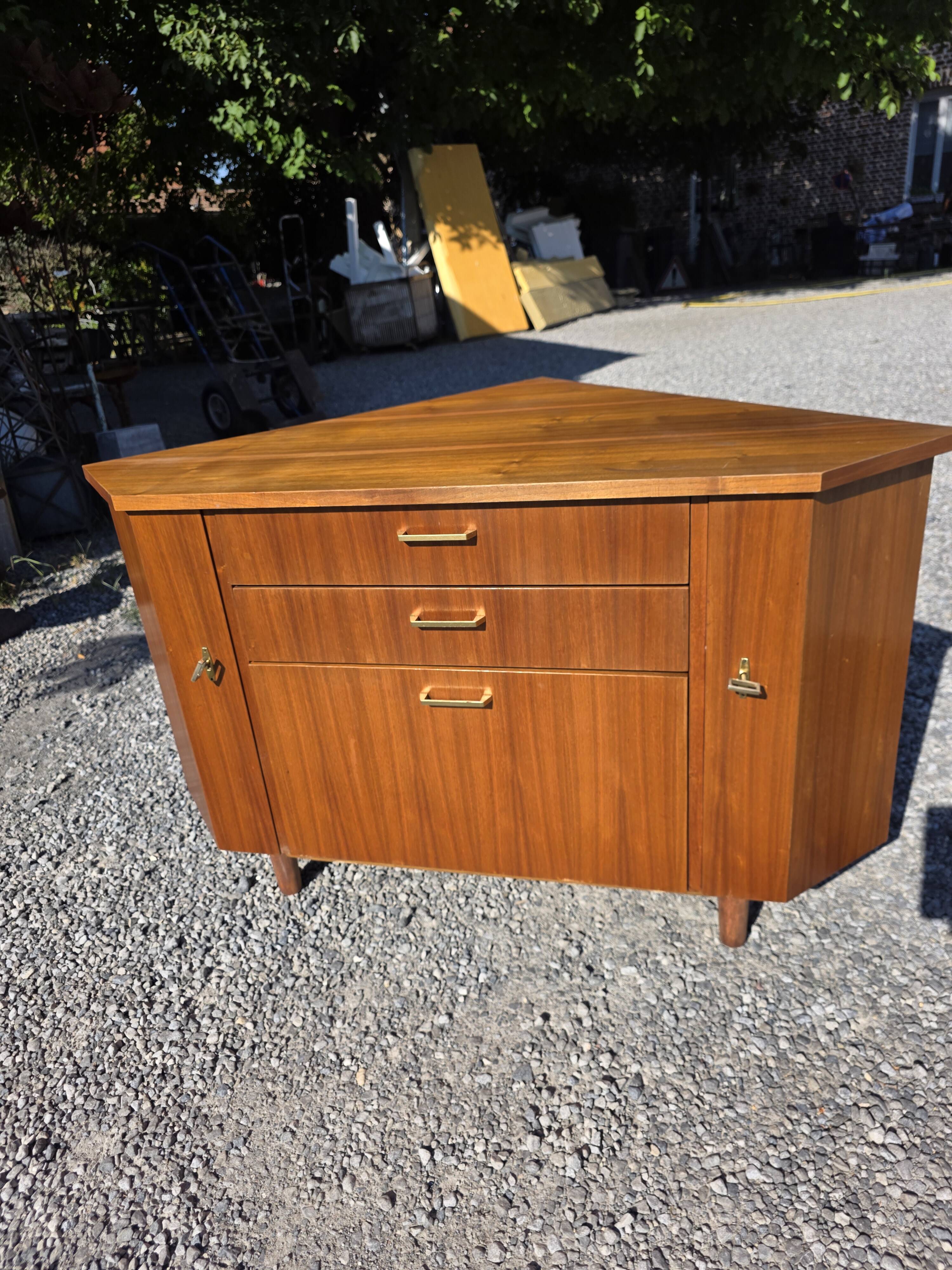 Scandinavian corner unit in teak from the 1960s.